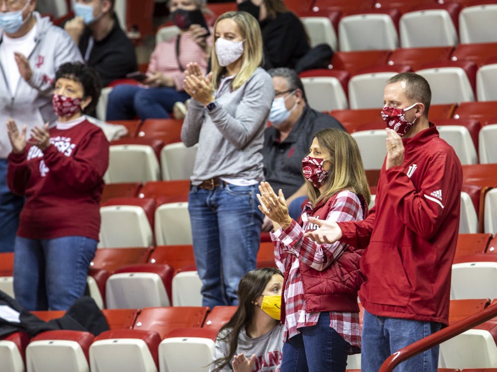 Indiana fans cheer as the women's basketball team takes the floor Dec. 20, 2020, at Simon Skjodt Assembly Hall. Fans at Assembly Hall will be expected to wear masks as long as the county's mandate is in place.