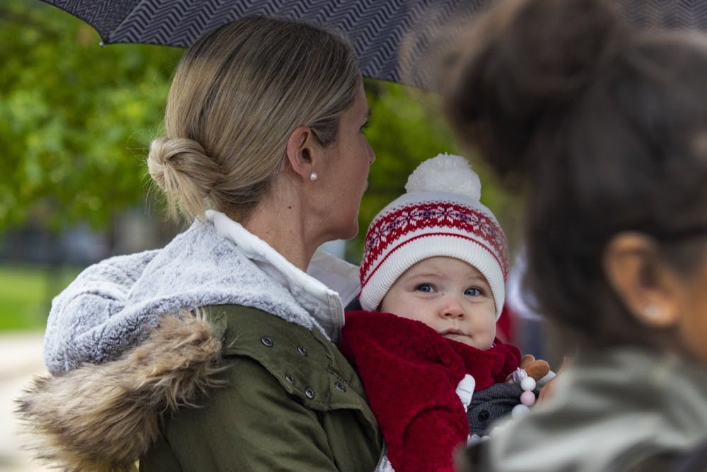 <p>Eleven-month-old Emma Starr looks out at the 2019 IU Homecoming Parade on Oct. 11 on Woodlawn Avenue. In the United States it can cost nearly $19 thousand on average to have a baby.</p>