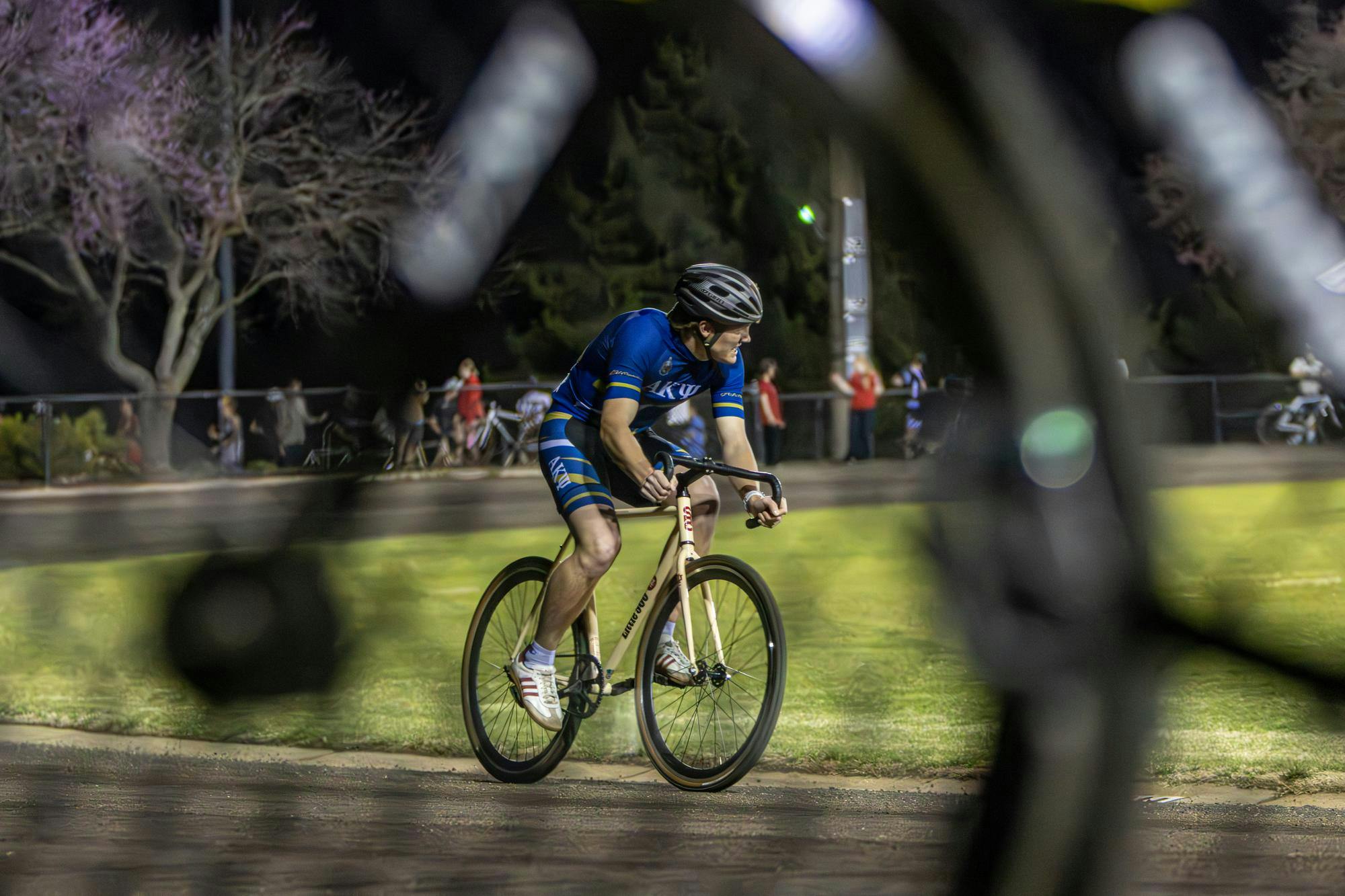 An Alpha Kappa Psi racer turns around the second turn during his individual time trial on Mar. 31, 2026 at Bill Armstrong Stadium in Bloomington. The individual time trials kicked off the first event of the racer's spring series. 
