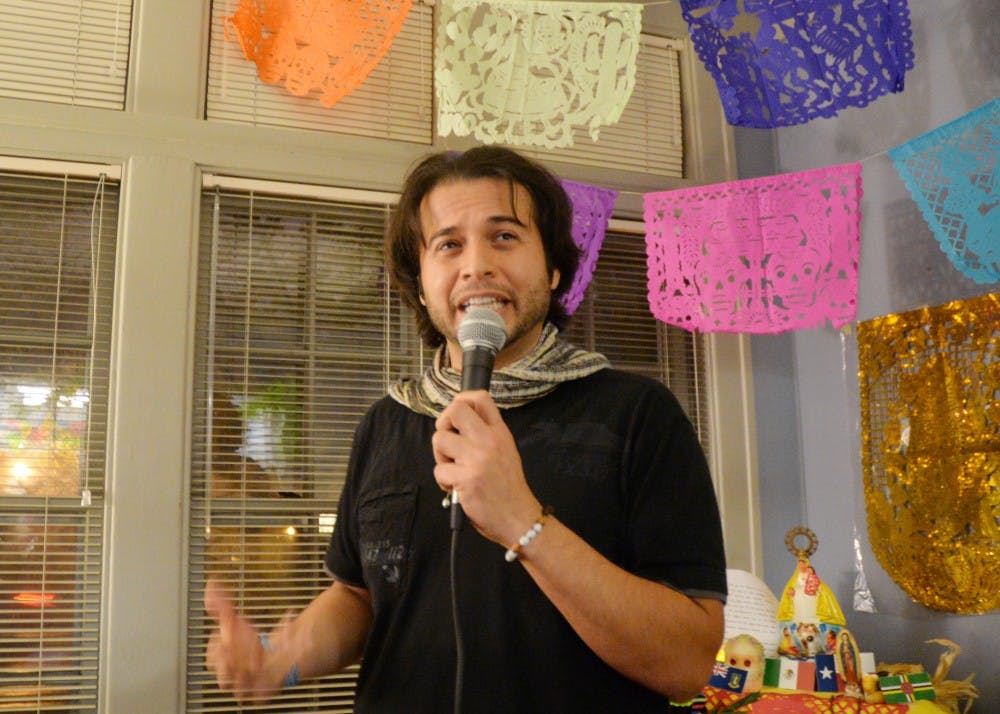 <p>Eric César Morales explains the history of Dia de los Muertos. The celebration took place Wednesday evening in La Casa Cultural Center, First Nations Cultural Center, LGBTQ+ Cultural Center and Canterbury House.</p>