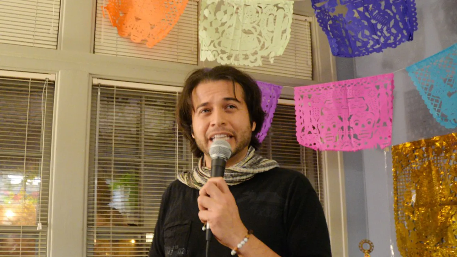 Eric César Morales explains the history of Dia de los Muertos. The celebration took place Wednesday evening in La Casa Cultural Center, First Nations Cultural Center, LGBTQ+ Cultural Center and Canterbury House.