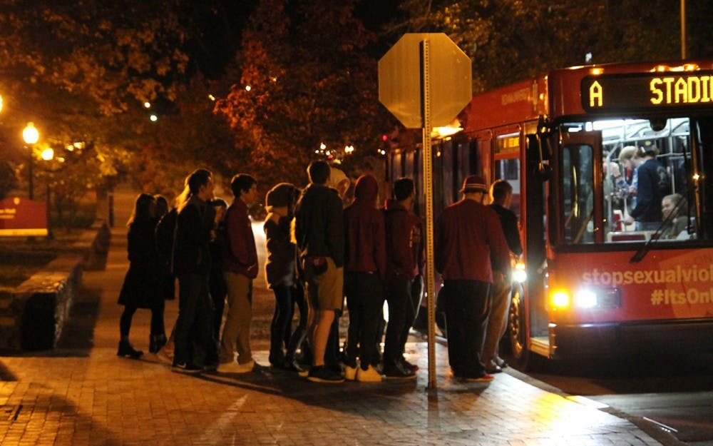 Students catching the bus home as winter sets in on Nov. 12, 2016 in Bloomington, Ind. Despite there being a football game earlier, the cold deterred the amount of partying that typically takes place.