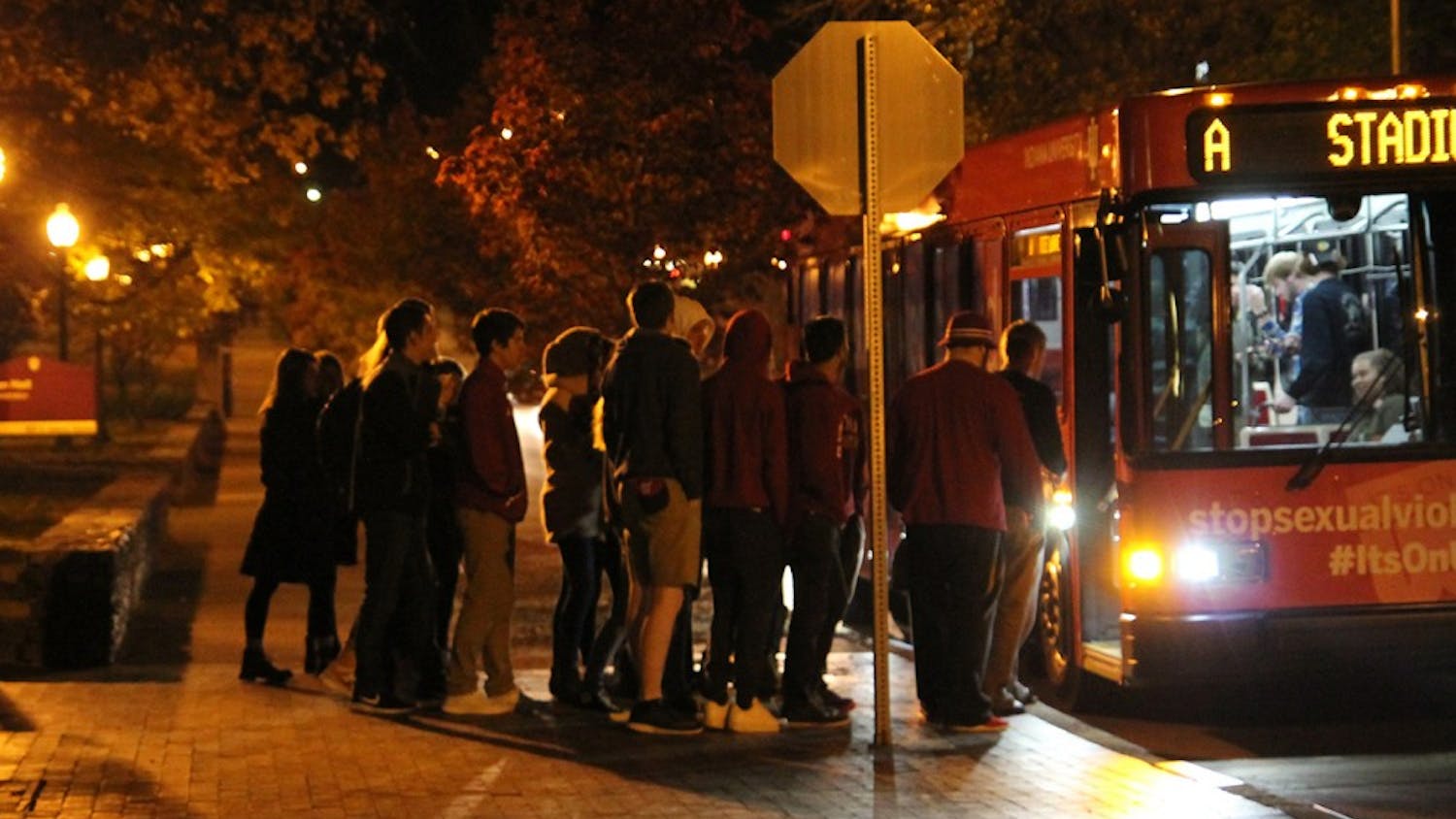 Students catching the bus home as winter sets in on Nov. 12, 2016 in Bloomington, Ind. Despite there being a football game earlier, the cold deterred the amount of partying that typically takes place.