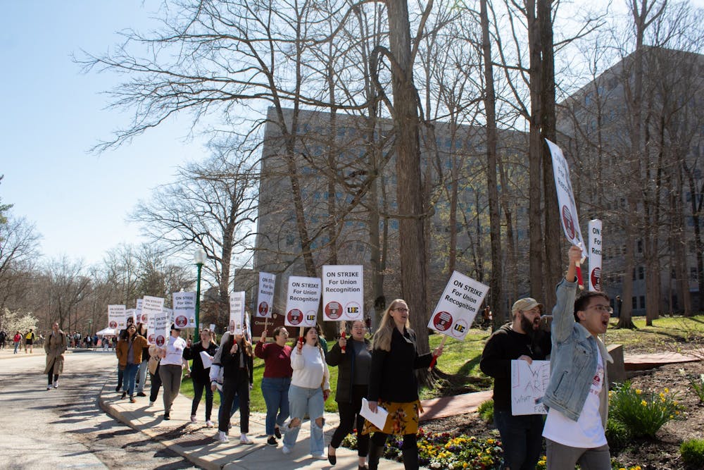 <p>Graduate workers march down South Woodlawn Avenue by Ballantine Hall and the Chemistry Building on April 14, 2022. IU faculty gathered April 26 to discuss concerns regarding the administration’s response to the graduate worker strike.</p>