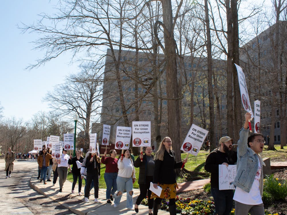 Graduate workers march down South Woodlawn Avenue by Ballantine Hall and the Chemistry Building on April 14, 2022. IU faculty gathered April 26 to discuss concerns regarding the administration’s response to the graduate worker strike.