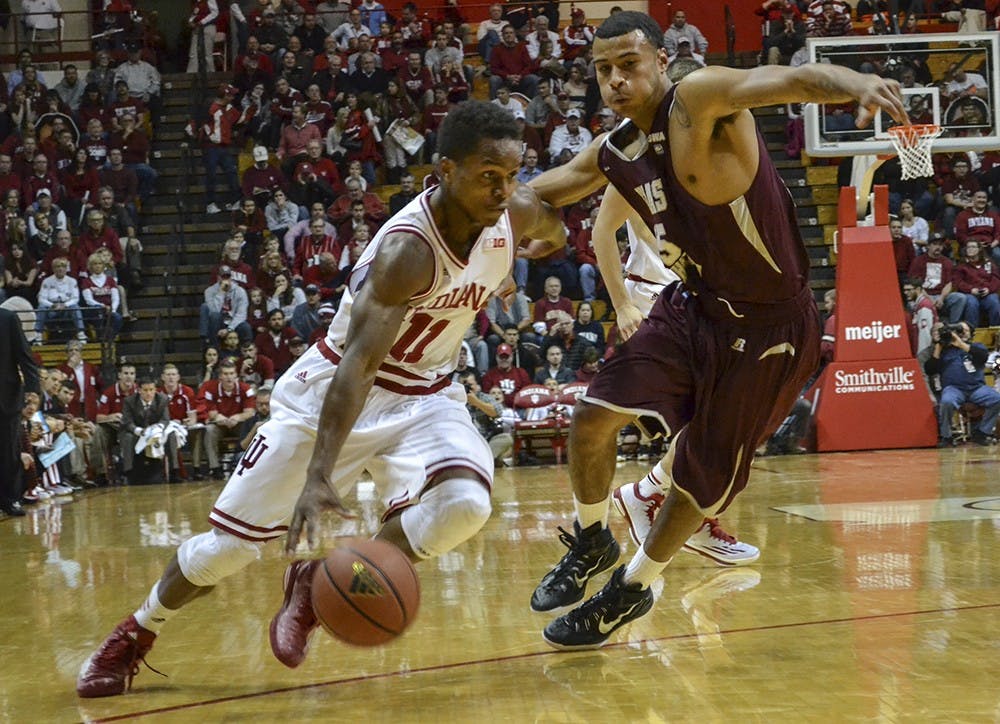 Junior guard Kevin Yogi Ferrell drives past his defender during IU's game against Texas Southern on Monday at Assembly Hall.