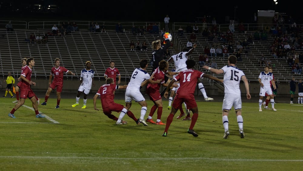 Redshirt senior goalkeeper Bryant Pratt catches a goal attempt against Notre Dame at Bill Armstrong Stadium. On Tuesday in Madison, Wisconsin, redshirt junior midfielder Quinten Helmer scored in Indiana men&#x27;s soccer&#x27;s 2-1 victory against the Badgers.