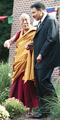 IDS File PhotoHis Holiness the Dalai Lama speaks with Muhammad Ali Sept. 8, 2003 before the dedication of the Chamtse Ling. His Holiness will be making another visit to Bloomington this Oct.