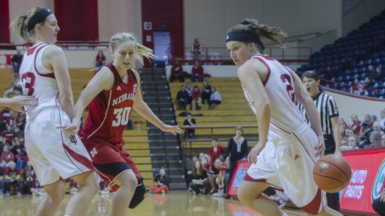 Freshman guard Jess Walter dribbles behind her back while freshman forward Amanda Cahill sets a screen against Nebraska at Assembly Hall during the Hoosier's final home game of the season. IU lost 67-64. 