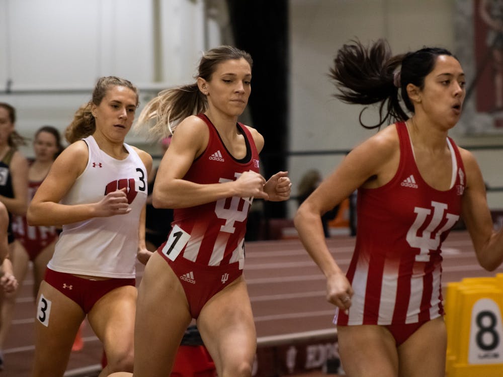 Senior Bailey Hertenstein, middle, runs the mile race at Indiana University Relays Jan. 29, 2022, at the Harry Gladstein Fieldhouse. Hertenstein was part of Indiana’s 400-meter relay team, whose fifth-place time marks the fifth-best time in program history.