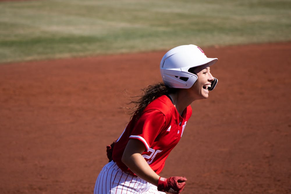 <p>Junior outfielder Cora Basset rounds the bases after hitting her second of 2 homeruns against Western Illinois University on March 5, 2022. IU swept the weekend tournament winning all four games.</p>
