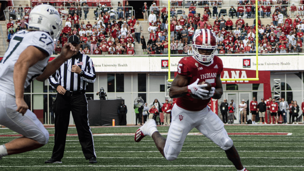 Graduate running back Stephen Carr rushes against Michigan State on Oct. 16, 2021, at Memorial Stadium. Indiana lost to Michigan State 20-15.