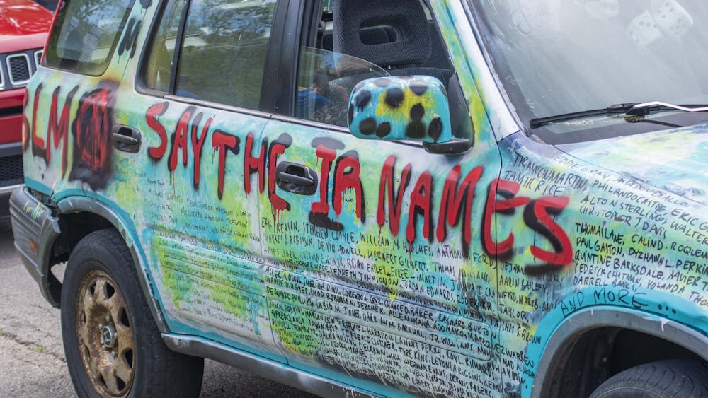 A Honda CR-V decorated with Black Lives Matter slogans is parked June 5 next to Dunn Meadow. A few other cars were decorated similarly, and many protesters at the June 5 ‘Enough is Enough’ protest held up signs they had decorated themselves.
