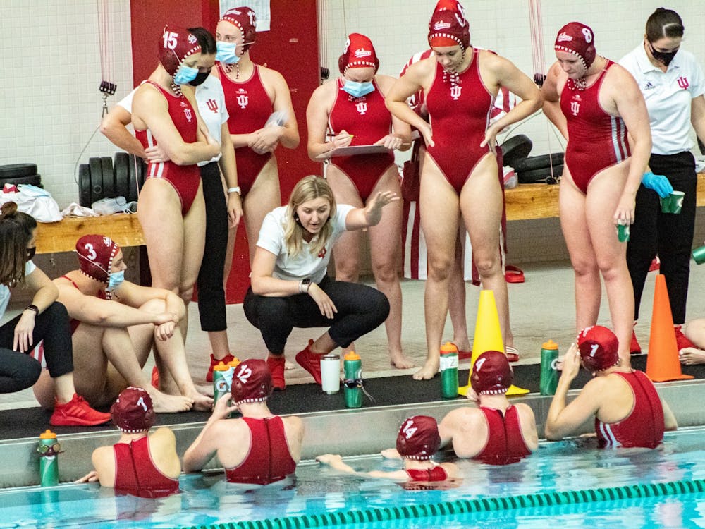 Head coach Taylor Dodson talks to the Hoosiers prior to their April 13, 2021 water polo match against UCLA. Indiana beat Ottawa 22-5. 