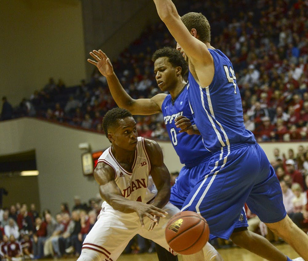 Senior guard Kevin "Yogi" Ferrll passes the ball during the game agaisnt IPFW on Wednesday at Assembly Hall. The Hoosiers defeated the Mastodons 90-65.