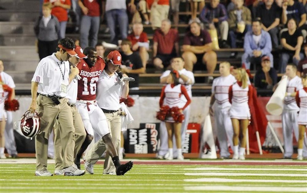 IU cornerback Christopher Phillips is helped off the field during IU's 42-20 loss to Ball State on Saturday night at Memorial Stadium. Phillips will miss the remainder of the season with a torn ACL.