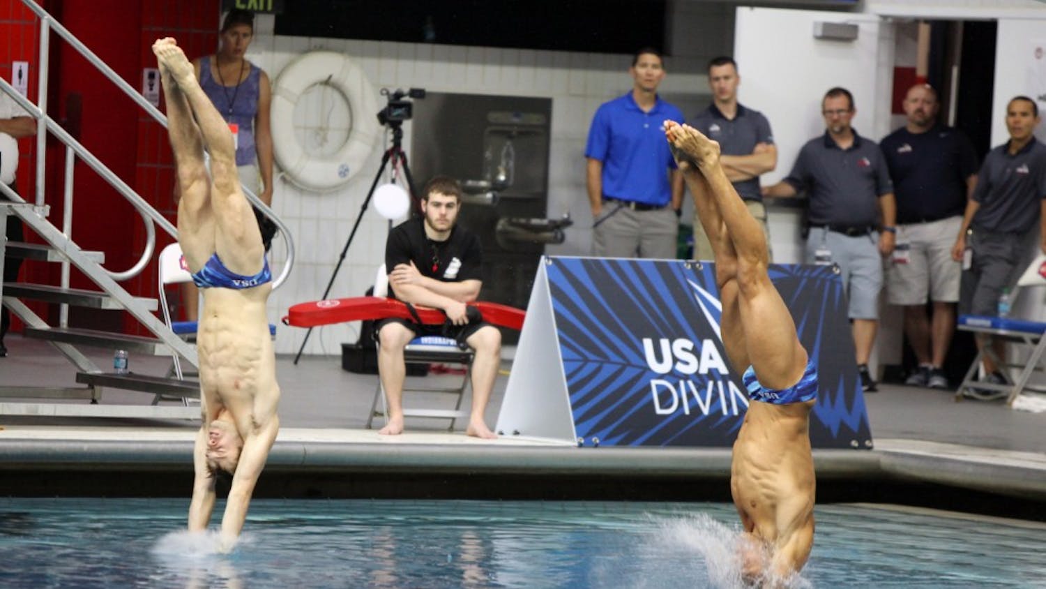 Michael Hixon, left, and Samuel Dorman, right, dive during the men's synchronized 3-meter  springboard preliminaries at the 2016 U.S. Olympic Team Trials in Indianapolis Saturday. 