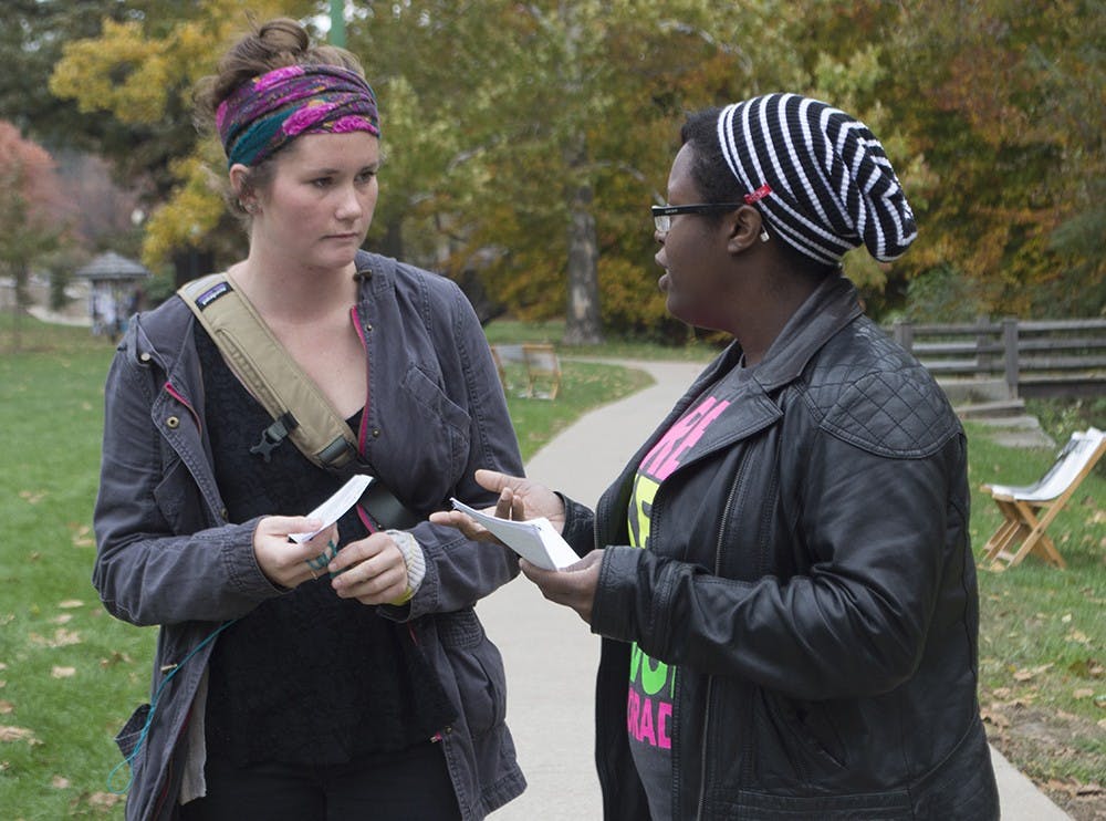 Junior Jessica Proctor from Stop the Kyriarchy speaks with Junior Saige Sentell about their Fag Demonstration Monday in Dunn Meadow.