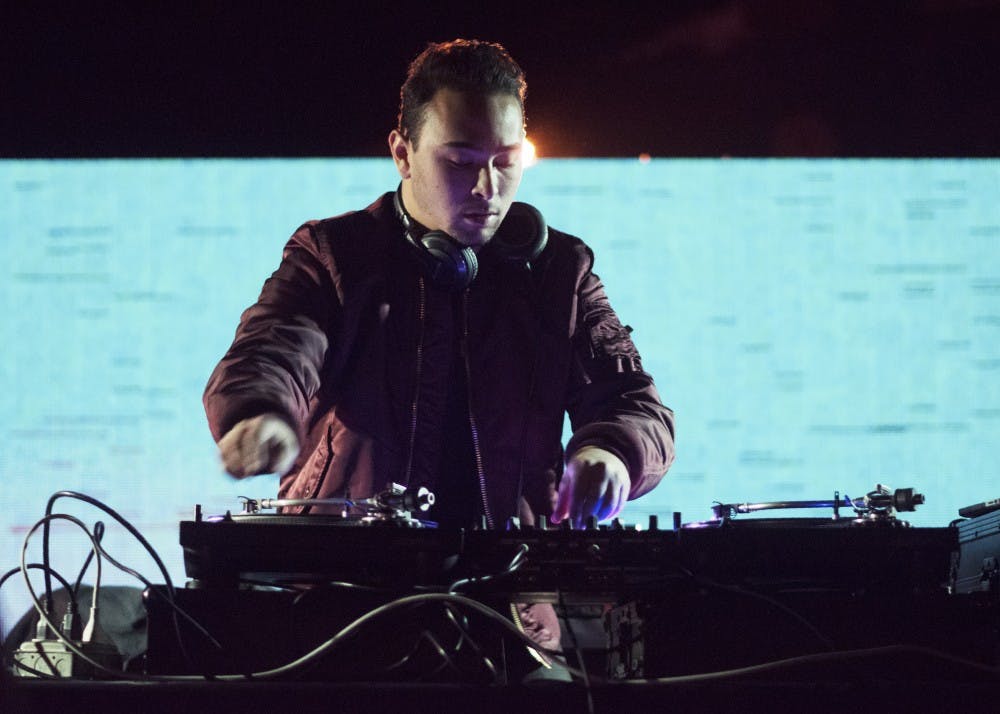 <p>IU junior Mark Matsuki performs a set on Friday night at the Bluebird. Matsuki is part of a DJ duo with IUPUI senior Niko Flores. Together, they recently won the Campus DJ National Competition.</p>