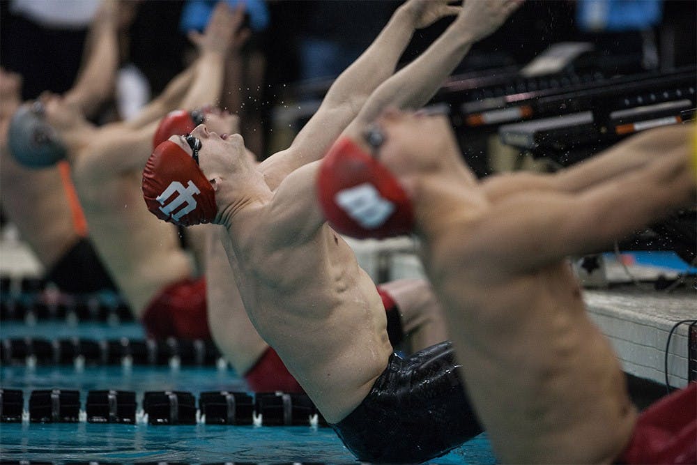 Junior backstroke swimmer Bob Glover leaps off the wall during the final heat of the 200-yard backstroke Saturday at the Boilermaker Aquatic Center. Glover placed second in the event with a time of 1:41.87, an NCAA B cut. The Hoosiers came in second place overall in the Big Ten Championship meet, their fourth second place finish in the meet over the past six years.