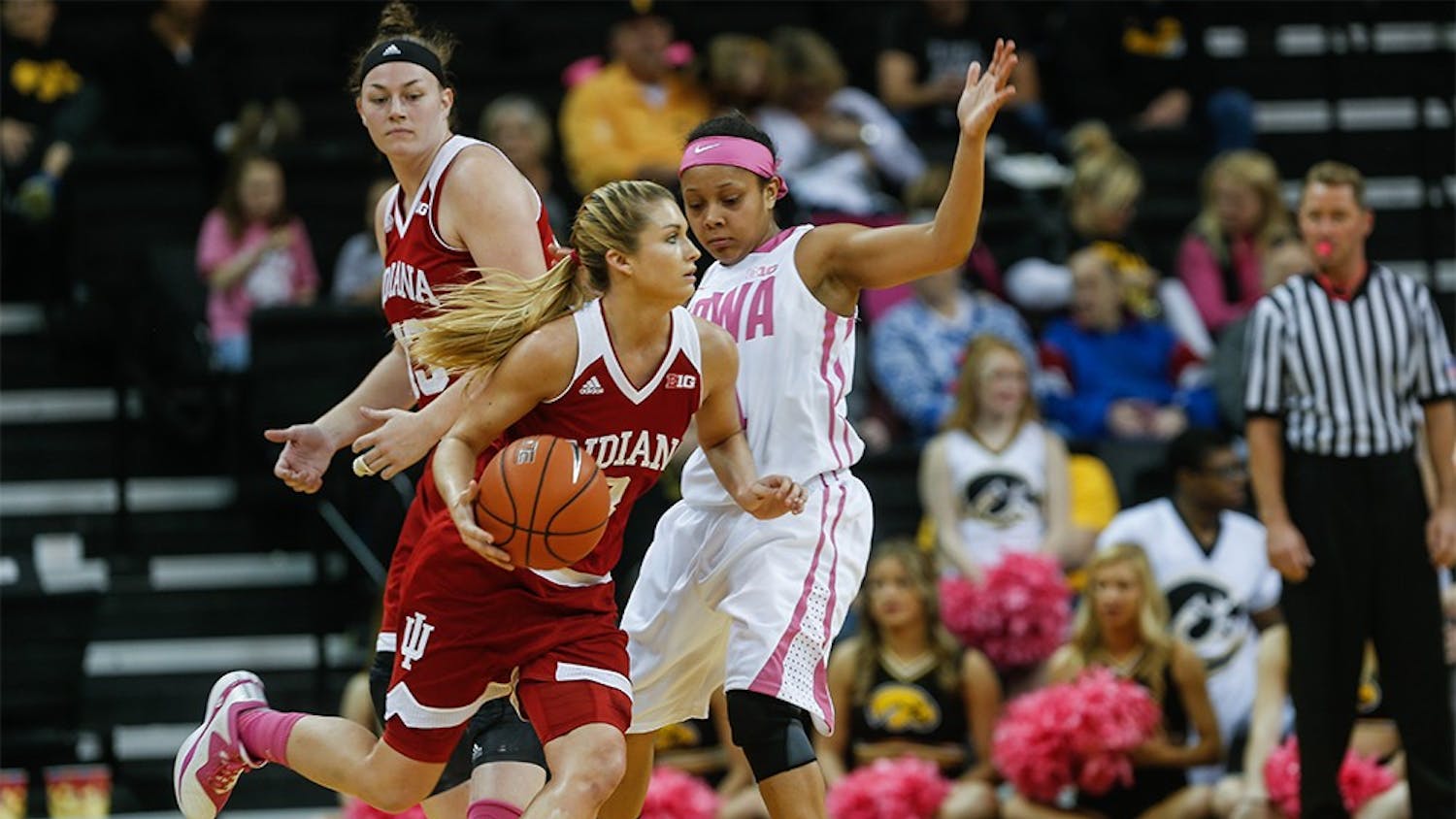 Sophomore guard Tyra Buss attempts to drive against Iowa's Tania Davis. IU lost, 76-73. (Anthony Vazquez/The Daily Iowan).