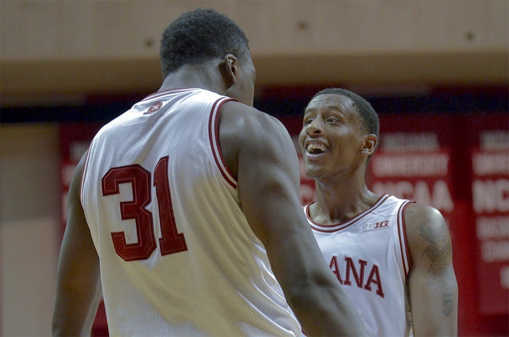 Junior guard Troy Williams congratulates freshman center Thomas Bryant during IU's game against Illinois on Tuesday at Assembly Hall. The Hoosiers won 103-69.
 