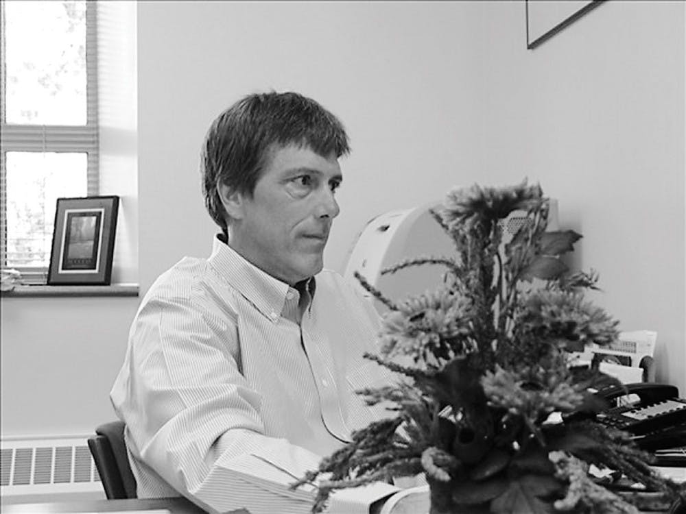 Associate chemistry professor Michael VanNieuwenhze works in his office Monday. His primary research focus involves identifying new antibacterial agents, but he will study cancer chemotherapy as well.