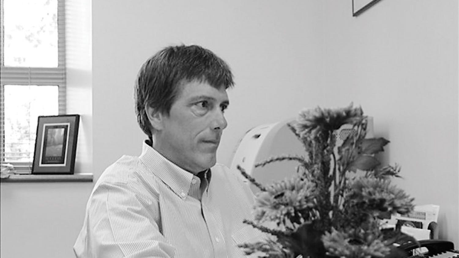 Associate chemistry professor Michael VanNieuwenhze works in his office Monday. His primary research focus involves identifying new antibacterial agents, but he will study cancer chemotherapy as well.