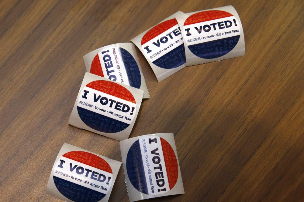 <p>Voting stickers at First Presbyterian Church in River Forest on Tuesday, March 15, 2016 in Chicago. The shape and size of these stickers varies by state and county.&nbsp;</p>