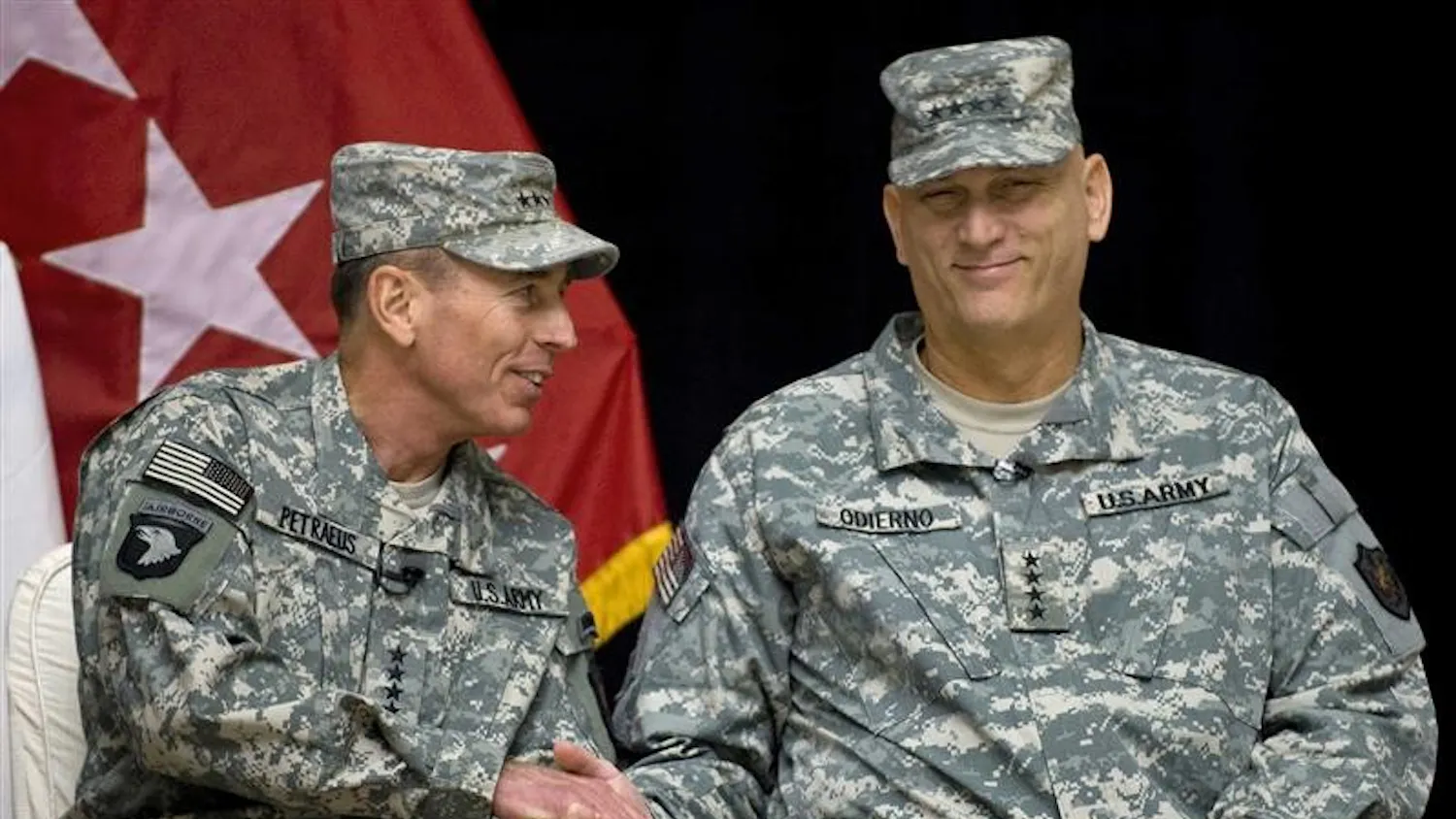 Gen. David Petraeus, left, and Lt. Gen. Ray Odierno, who rises to four-star rank, take part in a a formal change-of-command ceremony at the main U.S. military headquarters in Baghdad on Tuesday, Sept. 16, 2008. Odierno took over from Gen. David Petraeus.