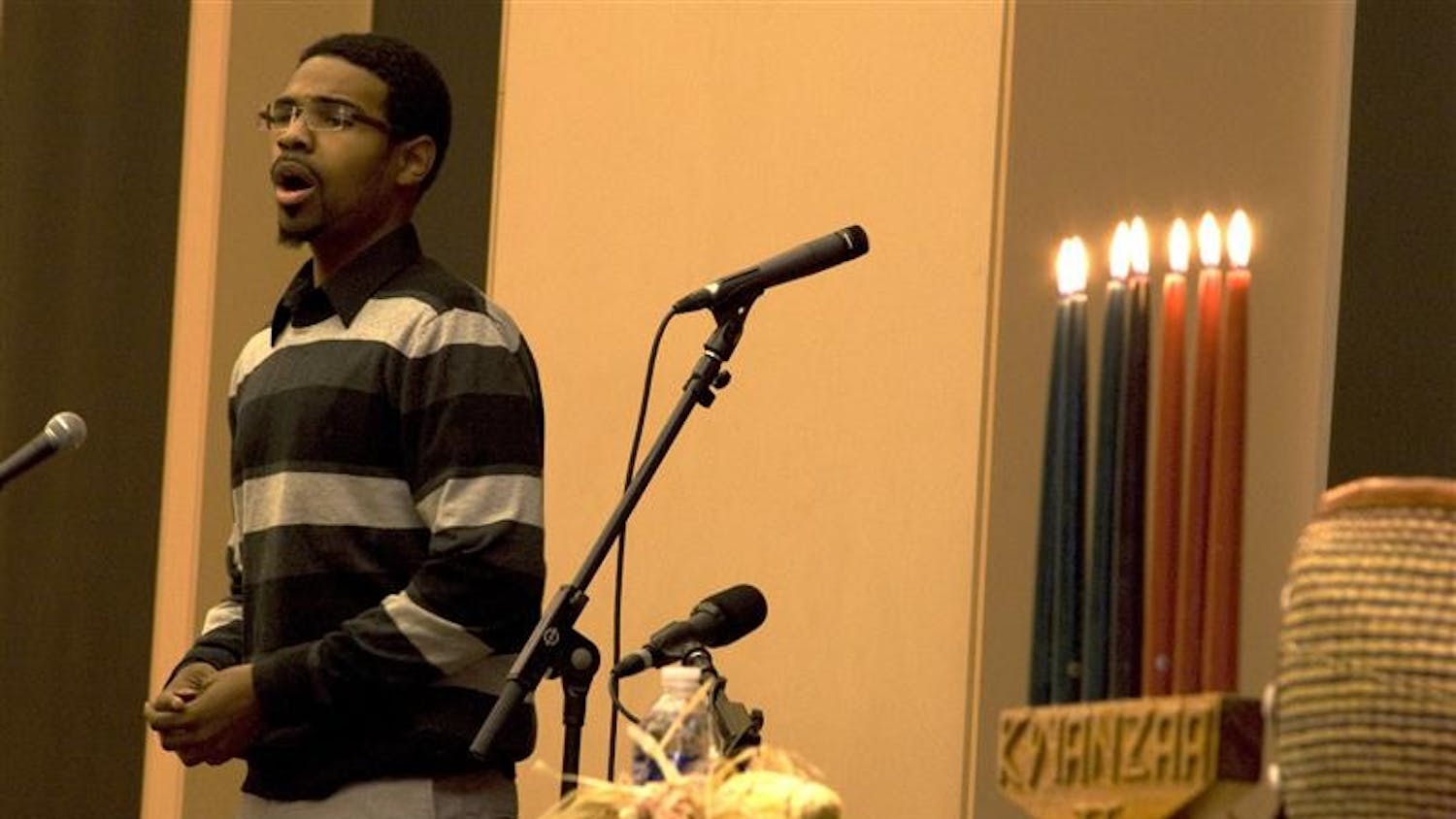 Justin Merrick sings a spiritual piece as part of the pre- Kwanzaa celebration. The celebration, put on by the Arts of the African Diaspora, was held at the Neal-Marshall Black Culture center on Thursday.