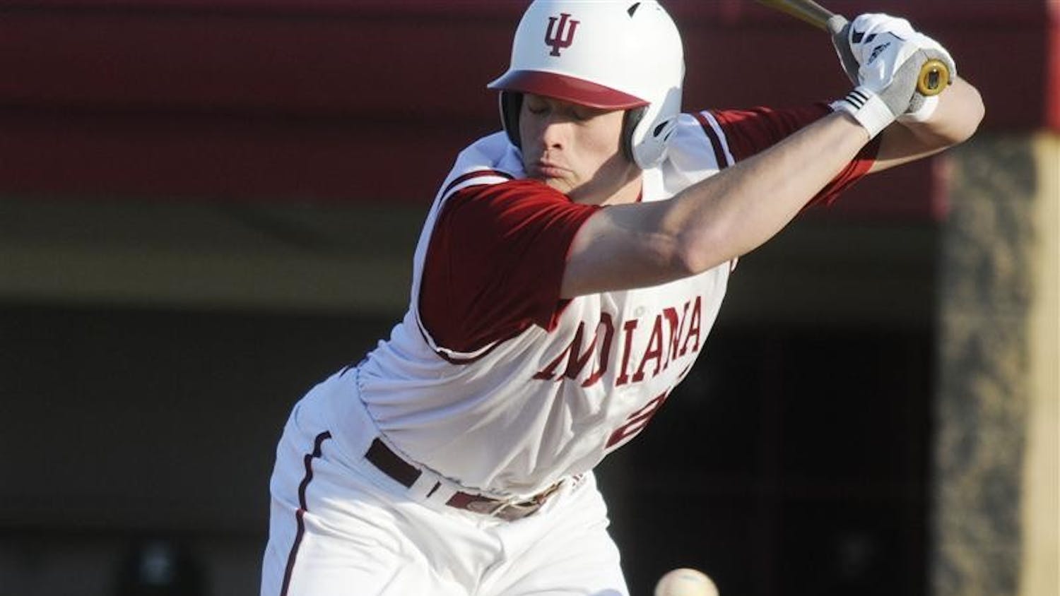 IU freshman catcher Josh Lyon jumps back from a close inside pitch during IU's 10-6 loss to Eastern Michigan on Wednesday evening at Sembower Field.