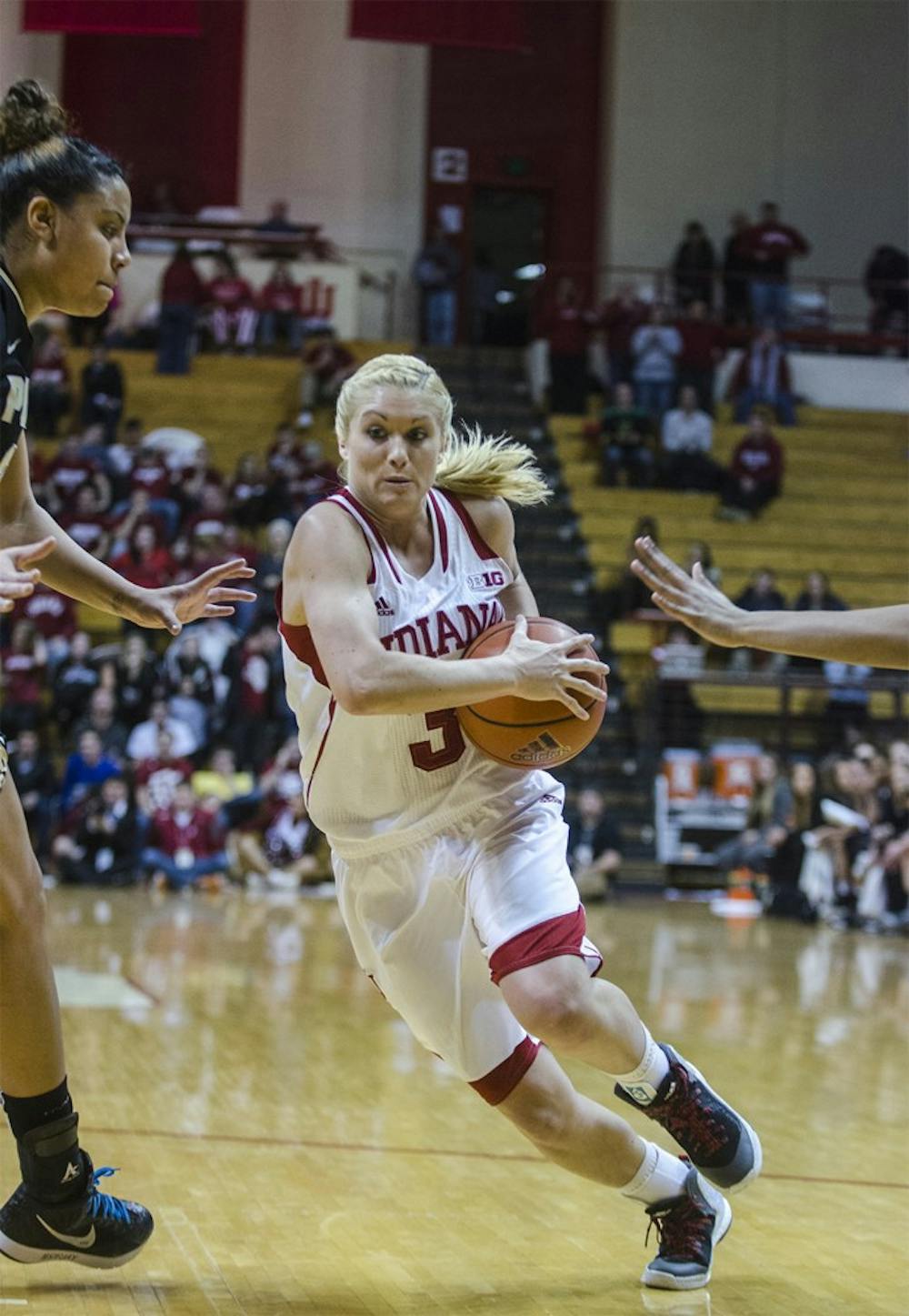Then-freshman guard Tyra Buss protects the ball from a pressuring Purdue defense at Assembly Hall on Jan. 4.