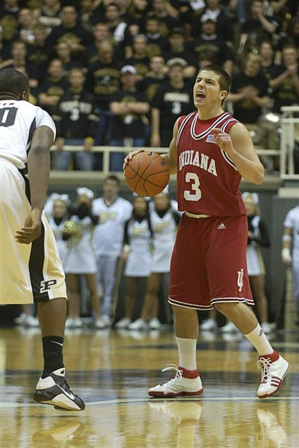 IU point guard Daniel Moore directs the Hoosier offense in the first half of Saturday's loss at Purdue. Moore played just five minutes with no points scored.
