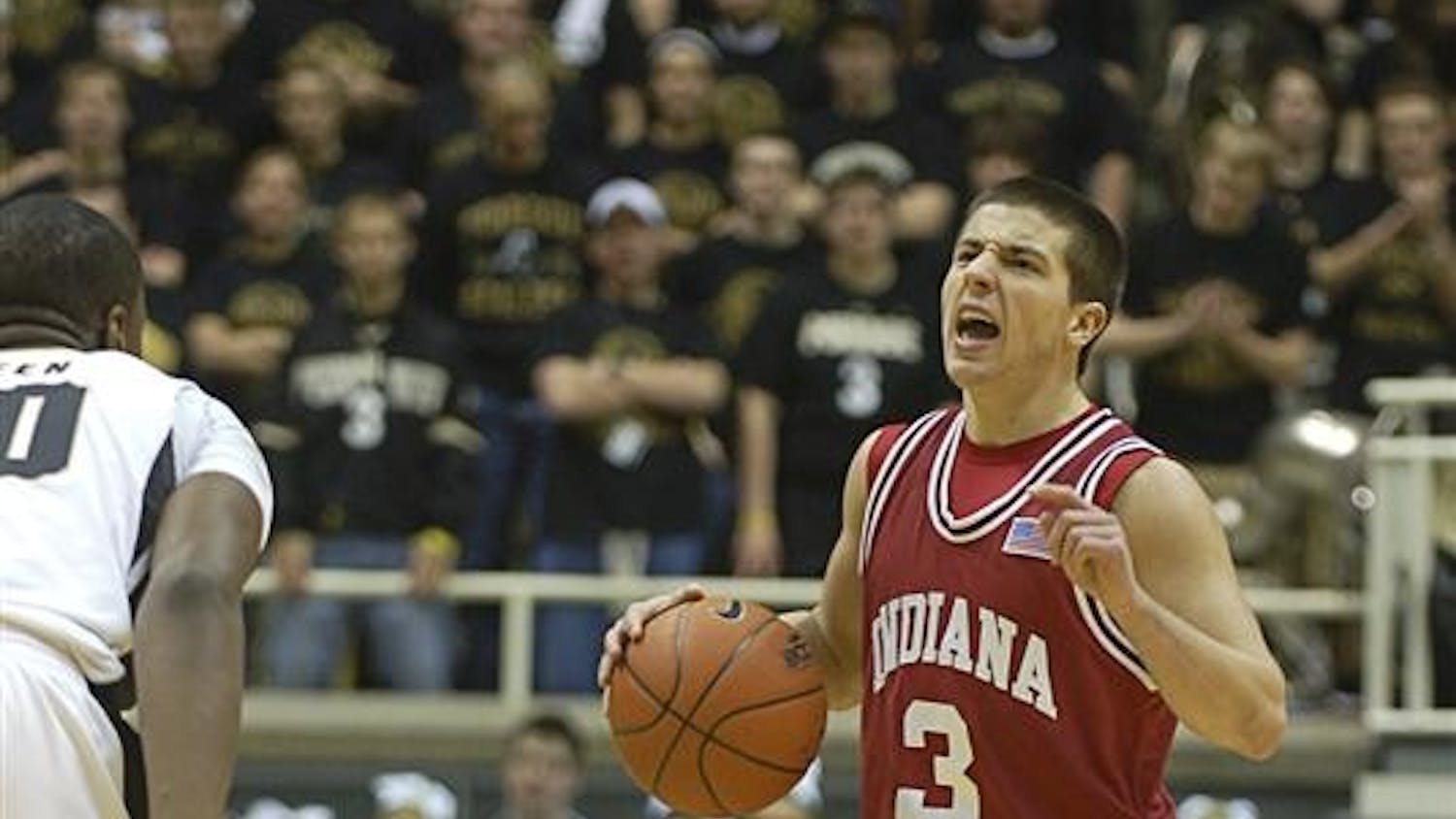 IU point guard Daniel Moore directs the Hoosier offense in the first half of Saturday's loss at Purdue. Moore played just five minutes with no points scored.