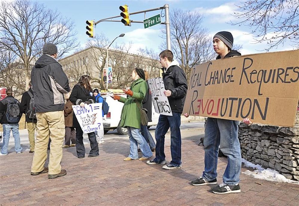 Members of IU Students for Liberty demonstrate at 10th Street and Fee Lane Tuesday following Barack Obama's inauguration. IU Students for Liberty, formerly Indiana University Students for Ron Paul, questions Obama's ability to bring "real change."