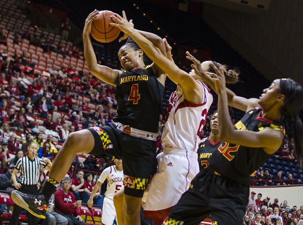Sophomore guard Alexis Gassion blocks a shot during IU's game against Maryland at Assembly Hall on Sunday.