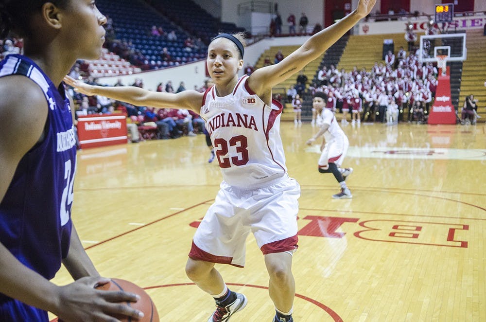 Sophomore guard Alexis Gassion disrupts an inbound pass durning the last two minutes of the IU’s game against Northwestern at Assembly Hall on Thursday. The game had 11 lead changes and the Hoosiers lost 75-69.
