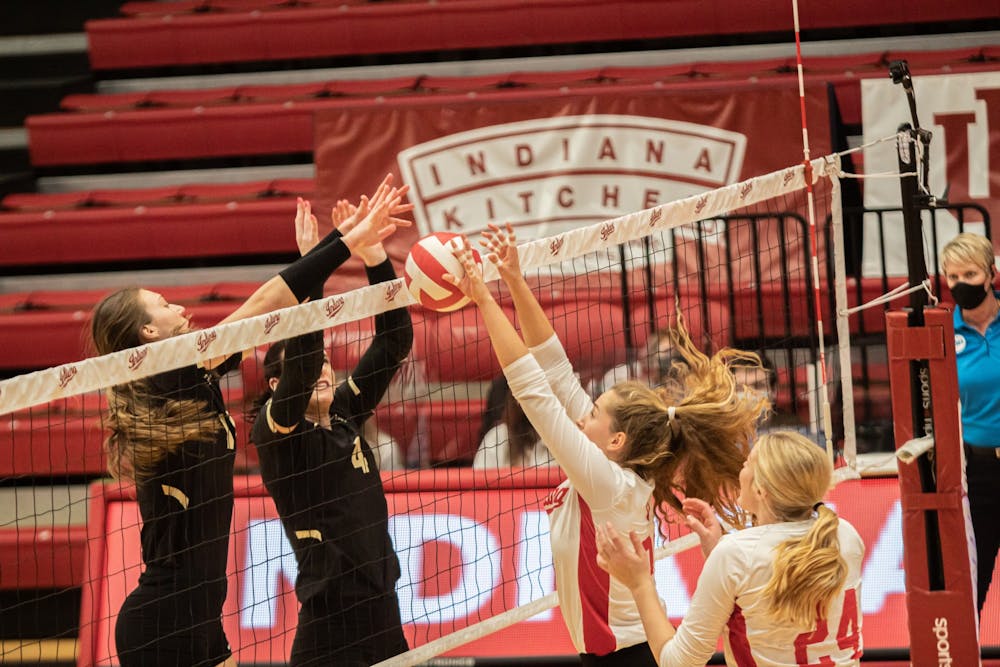 <p>Sophomore setter Emily Fitzner and freshman middle blocker Leyla Blackwell go up for a block against Purdue on Feb. 23, 2021, at Wilkinson Hall. IU will play Northwestern at 7 p.m. Nov. 18 at Wilkinson Hall.</p>