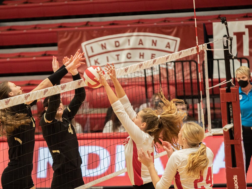 Sophomore setter Emily Fitzner and freshman middle blocker Leyla Blackwell go up for a block against Purdue on Feb. 23, 2021, at Wilkinson Hall. IU will play Northwestern at 7 p.m. Nov. 18 at Wilkinson Hall.