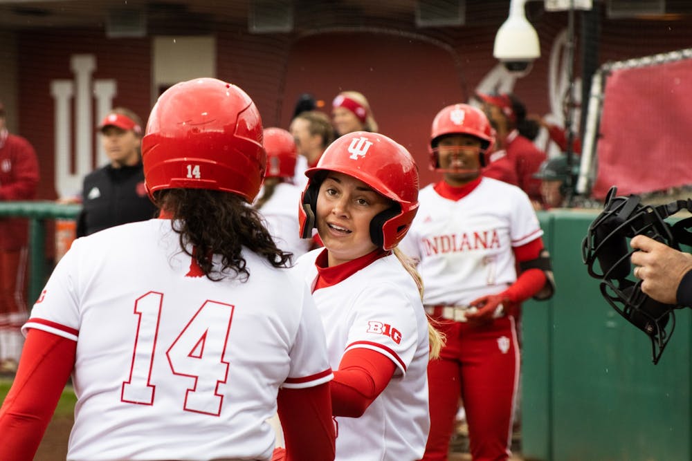 <p>﻿Freshman outfielder Taylor Minnick celebrates with teammates after scoring a run April 8, 2022. Indiana went 1-2 against Penn State this weekend.</p>