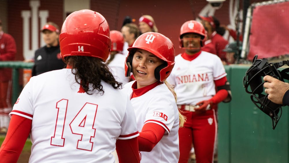﻿Freshman outfielder Taylor Minnick celebrates with teammates after scoring a run April 8, 2022. Indiana went 1-2 against Penn State this weekend.