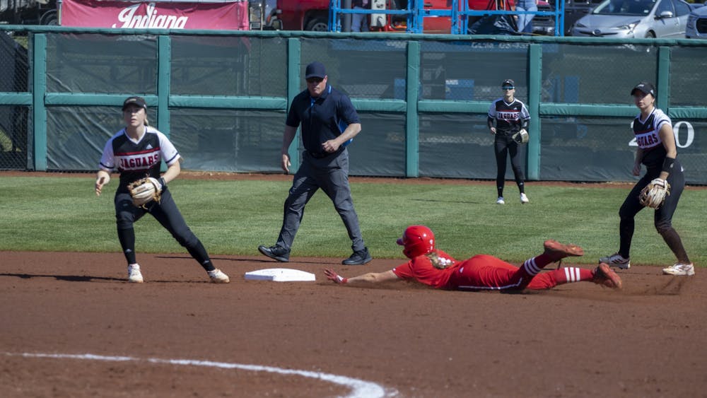 Freshman Taryn Kern dives into second pass while stealing a pass March 6, 2023, at Andy Mohr Field. Indiana postponed Friday&#x27;s game to Saturday for their home series against Maryland.
