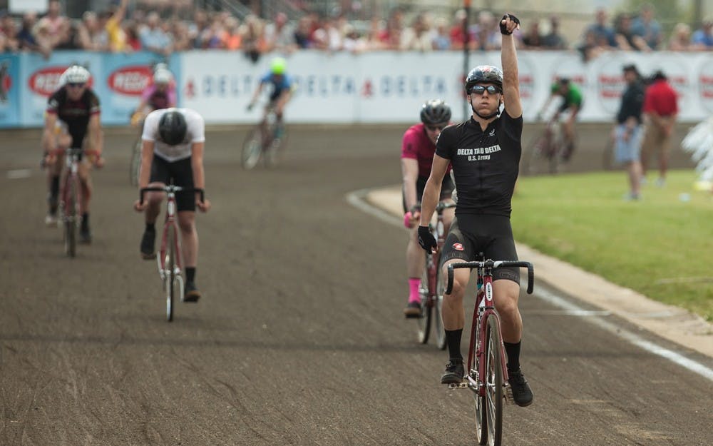 Delta Tau Delta rider senior Luke Tormoehlen celebrates after crossing the finish line first at Bill Armstrong Stadium on Saturday to secure Delta Tau Delta's second Little 500 victory in history.