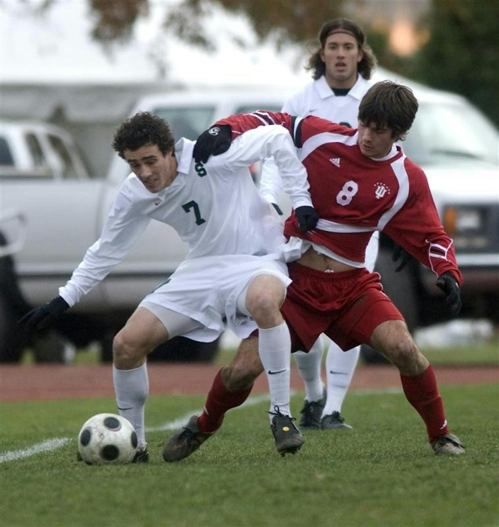 Senior midfielder John Mellencamp battles for possession with a Michigan State player Sunday, Nov. 16, in Madison, Wis.