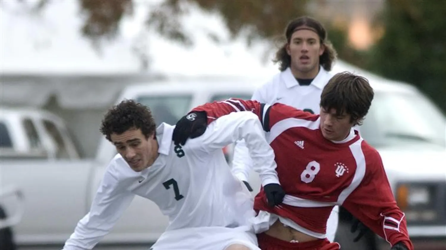 Senior midfielder John Mellencamp battles for possession with a Michigan State player Sunday, Nov. 16, in Madison, Wis.