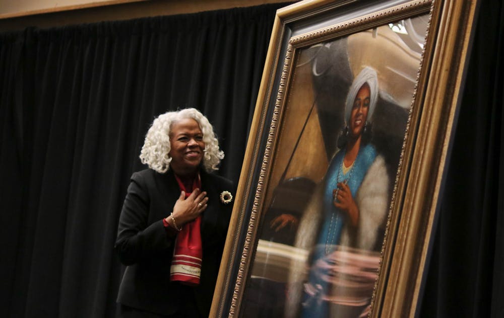 <p>Marietta Simpson rudy professor of voice for the Jacobs School of Music  reacts to the unveiling of the new portrait of world-renowned opera singer Camilla Williams Feb. 5 in the Indiana Memorial Union East Lounge. Williams became the first African American faculty member in the voice department at IU in 1977, and she retired in 1997. </p>