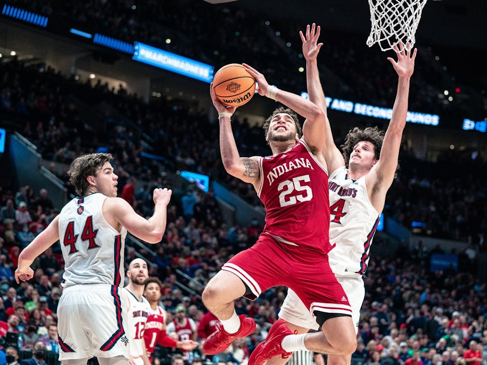 Then-senior forward Race Thompson attempts a layup March 17, 2022, at the Moda Center in Portland, Oregon. Thompson had his best game of the season in Indiana&#x27;s win against Little Rock.