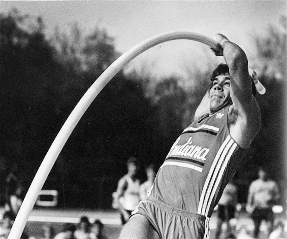 Former IU pole vaulter Dave Volz performs a vault during his freshman year in this file photo from the 1980-1981 edition of the Arbutus yearbook. Volz established several records at various levels across his illustrious career, including a fifth-place finish at the 1992 Olympics in Barcelona. He is now a volunteer coach for the IU track and field teams.