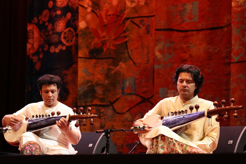<p>Amman &amp; Ayaan Ali Bangash perform as part of the 29th annual Lotus World Music and Arts Festival on Sept. 24, 2022. They both play the sarod — a staple in Indian music.</p>